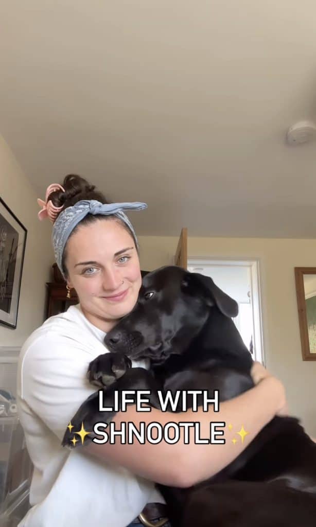 human hugging dog named Schnootle